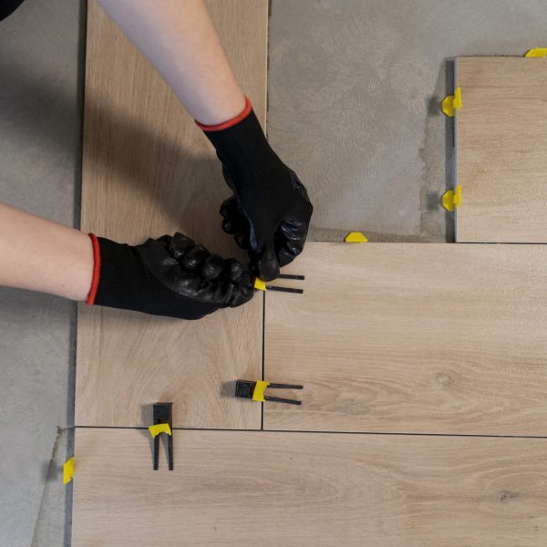 flat-lay-worker-tiling-floor